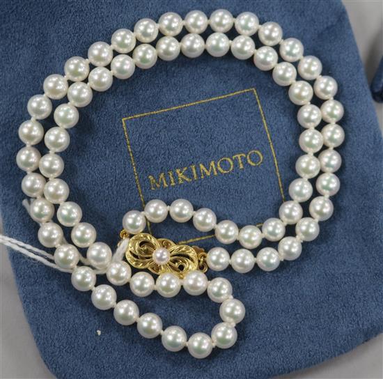 A single strand Mikimoto cultured pearl necklace with 18ct gold clasp,